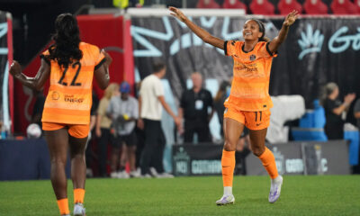 Yazmeen Ryan celebrates with Michelle Alozie after Alozie scored the match winner in Houston Dash's game against Gotham FC in Harrison, New Jersey on August 17, 2025.