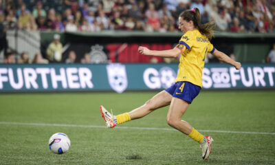 Paige Monaghan follows through on a right-footed kick.
